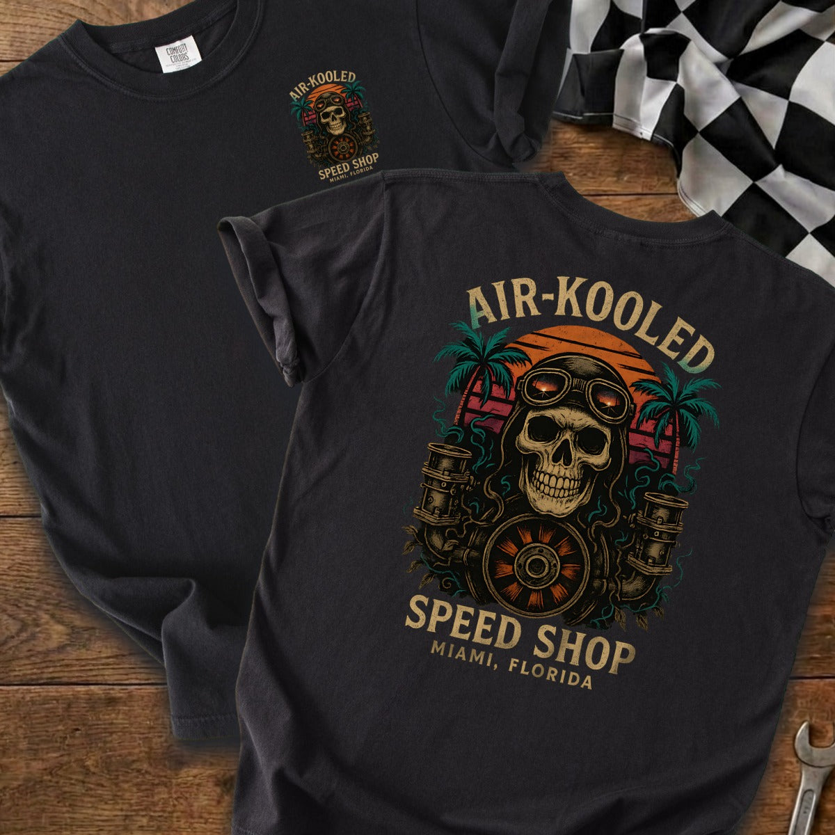 T-shirt with skull graphic, goggles, palm trees, and text "AIR-KOOLED SPEED SHOP"
