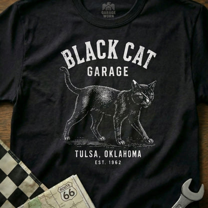 Black cat graphic t-shirt with "Black Cat Garage Tulsa, Oklahoma Est. 1962" text.