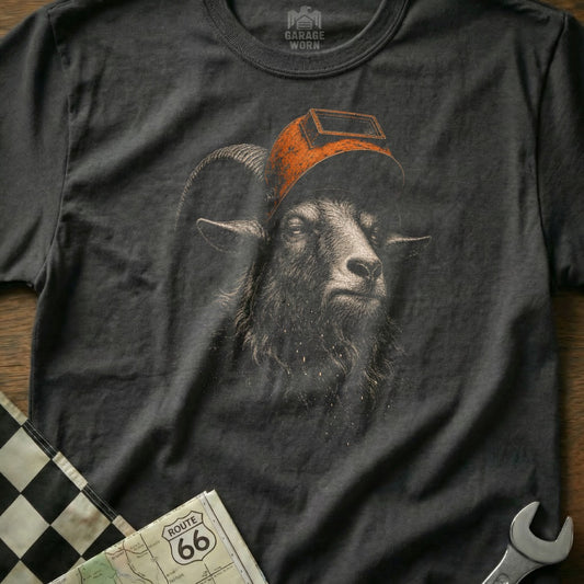 Dark t-shirt with a graphic of a goat wearing a welding mask, near Route 66 map.