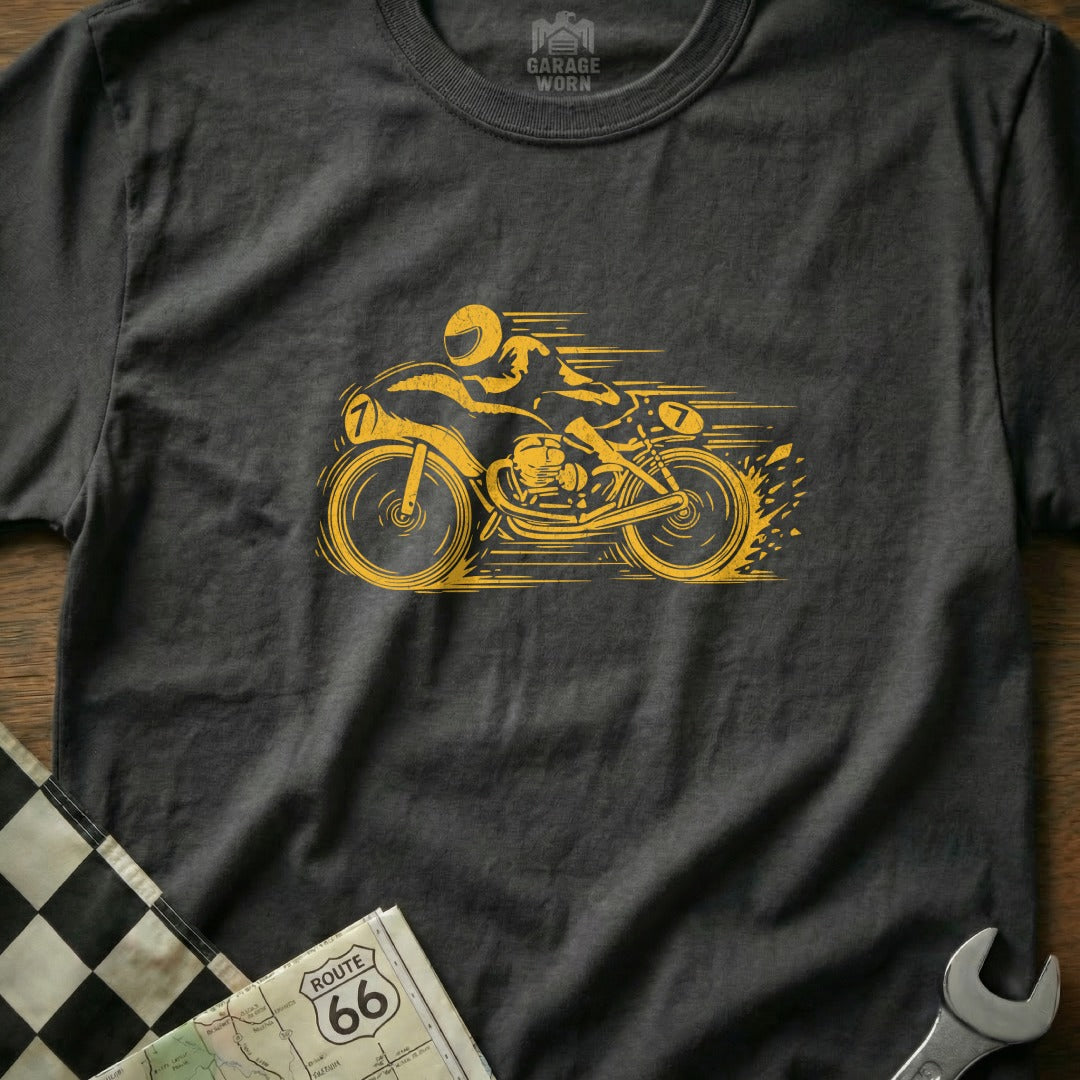 Yellow motorcycle racer graphic on a dark grey t-shirt.