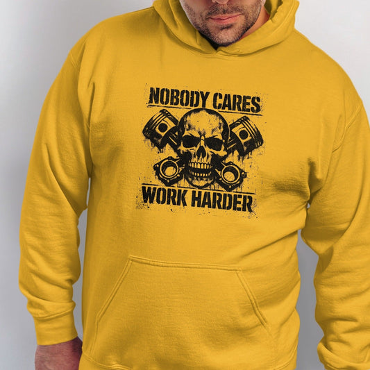 Yellow hoodie with a skull graphic and text "Nobody Cares Work Harder."