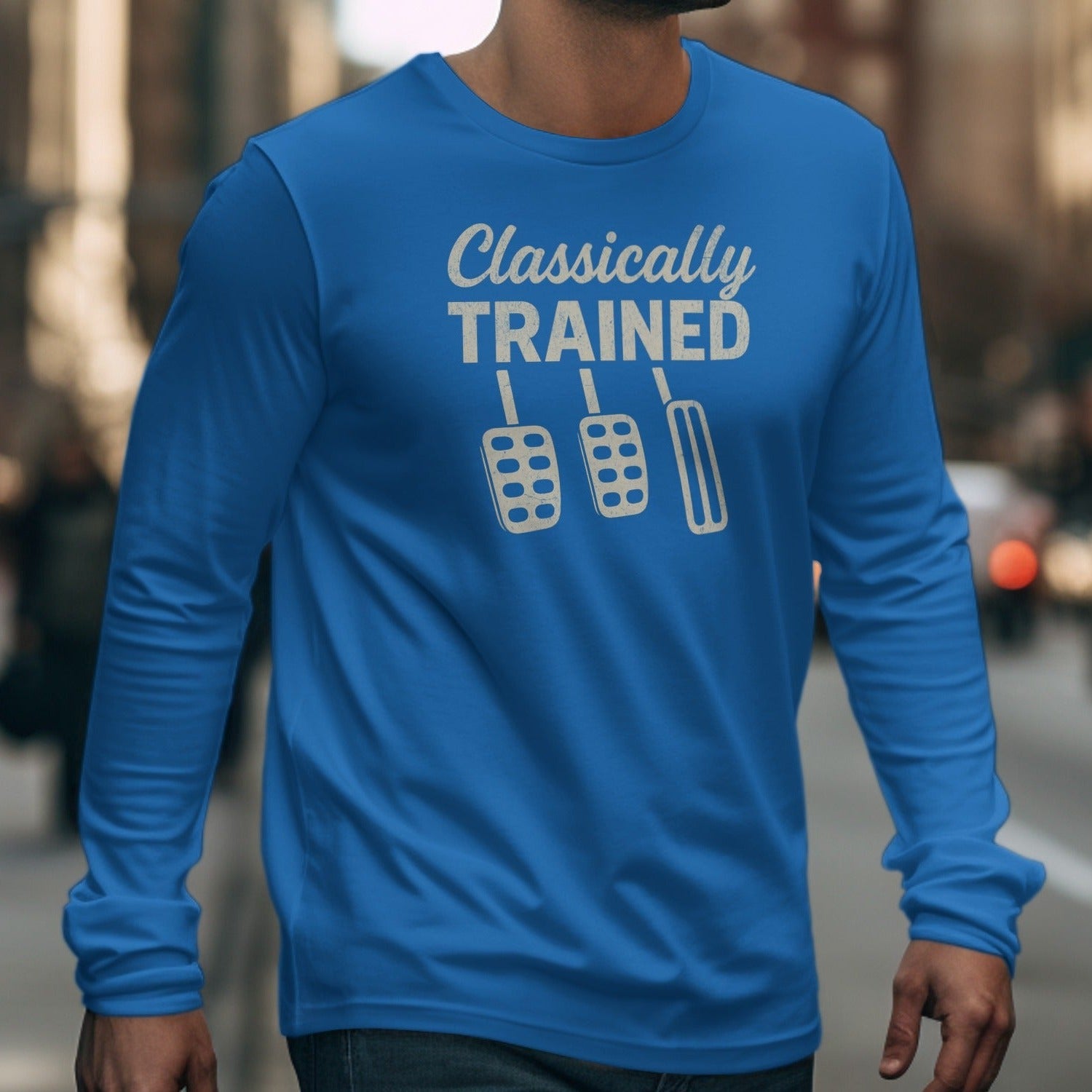 Blue long-sleeve shirt with "Classically TRAINED" and three pedals graphic.