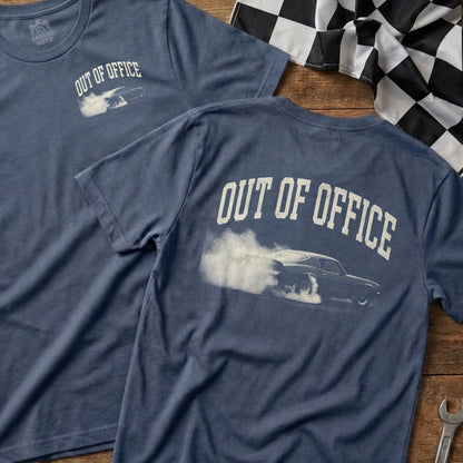 Blue t-shirt with "OUT OF OFFICE" text and a vintage car skidding.