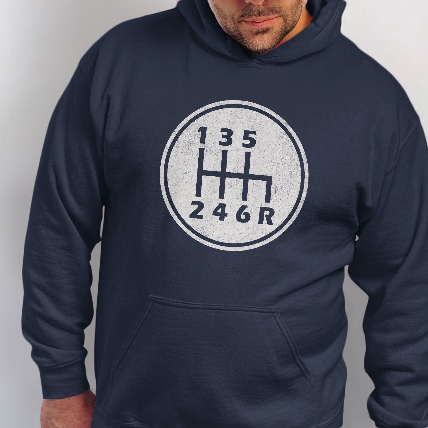 Navy hoodie with a white distressed manual transmission shift pattern graphic.