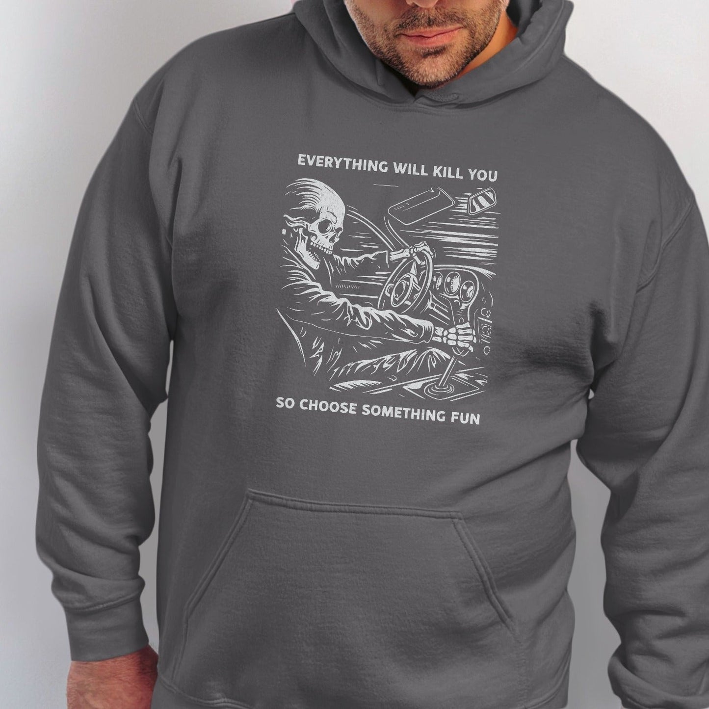 Skeleton driving, "Everything will kill you so choose something fun" text.