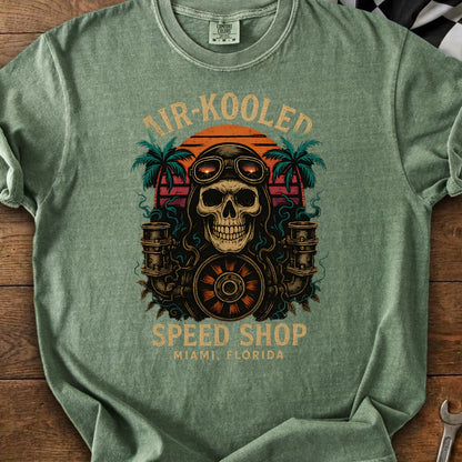 Skull with goggles and engine parts above "Air-Kooled Speed Shop Miami, Florida".