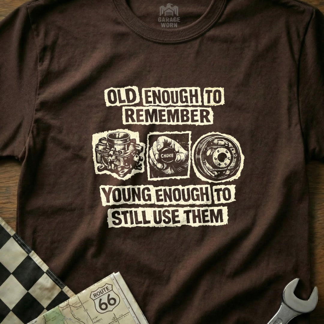 Brown t-shirt with "Old enough to remember, young enough to still use them" text and graphics.