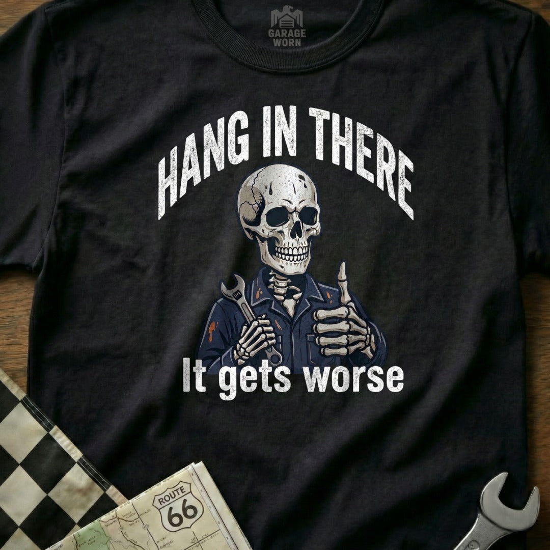 Black t-shirt with skeleton holding wrench, "Hang in there it gets worse" text.