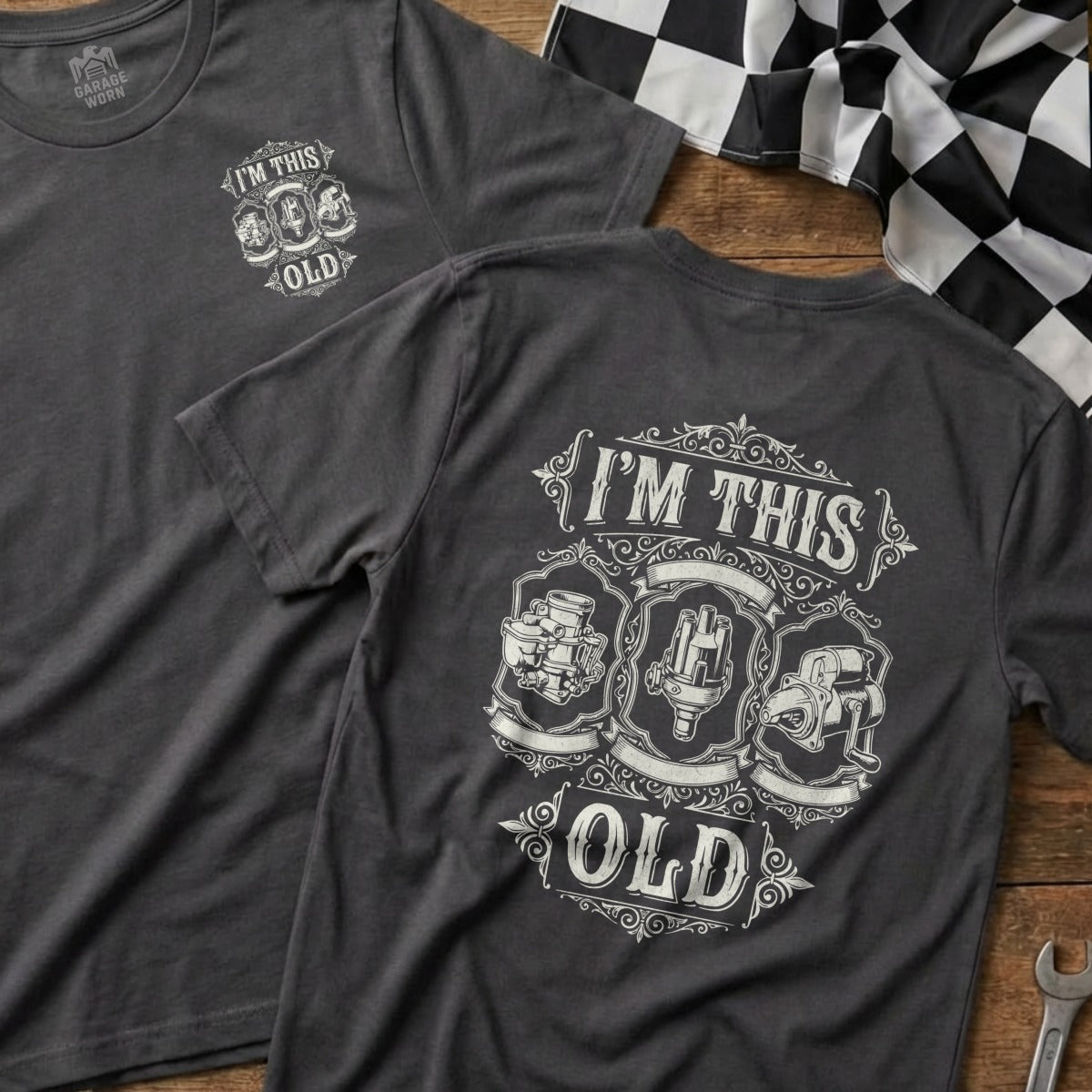 Dark gray t-shirt with "I'm This Old" text and vintage engine parts graphic.