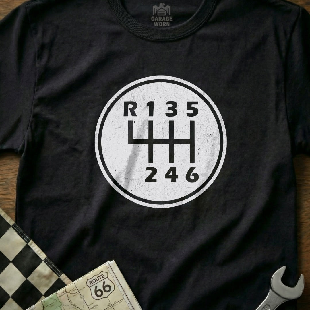 Black t-shirt with white circular gear shift pattern and "R 1 3 5" and "2 4 6".