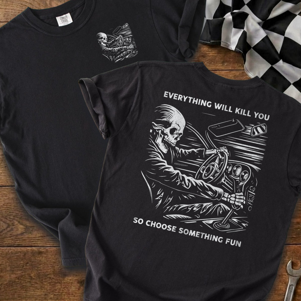 Black t-shirt with skeleton driving and text "EVERYTHING WILL KILL YOU, SO CHOOSE SOMETHING FUN."