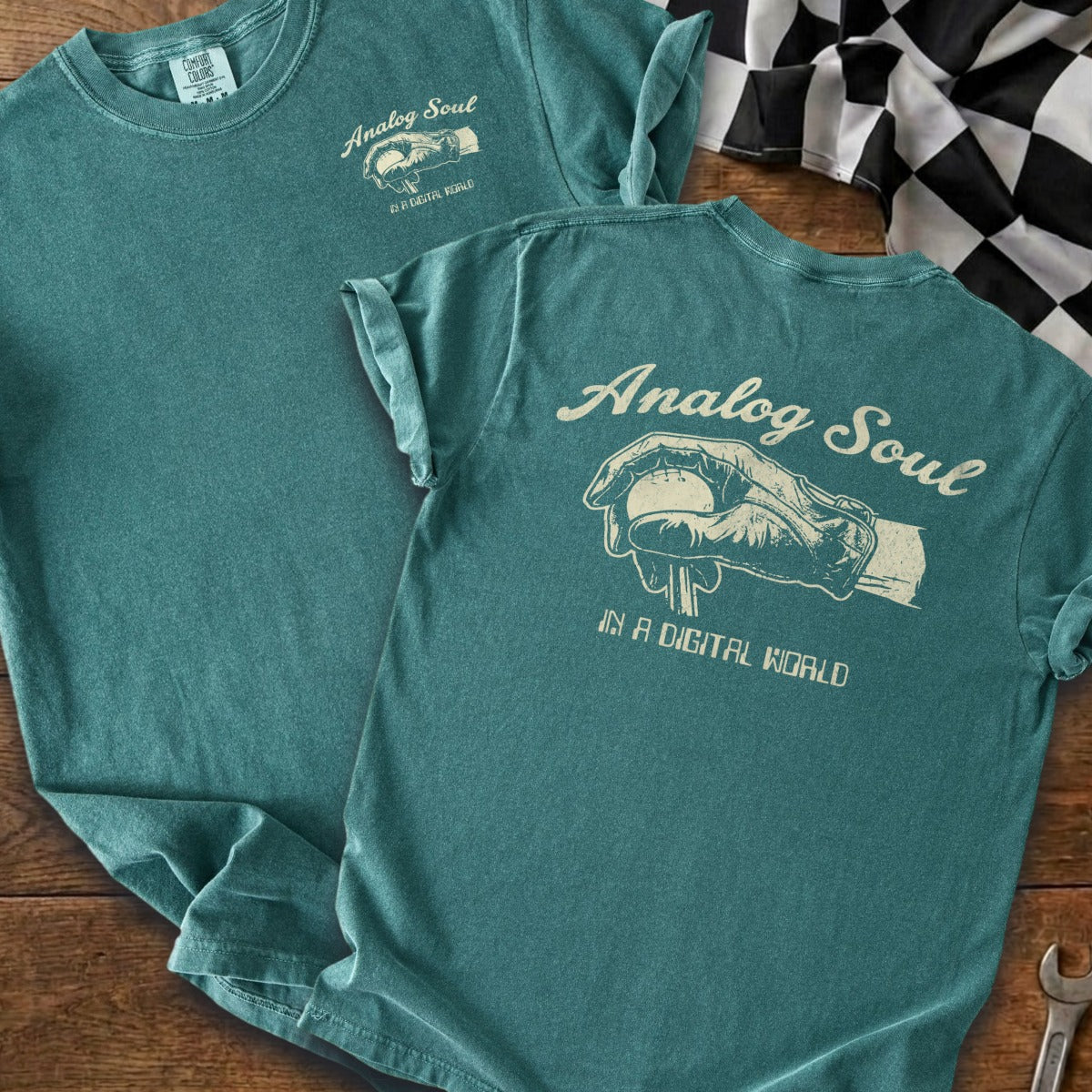 Teal t-shirts with "Analog Soul in a Digital World" text and graphic.