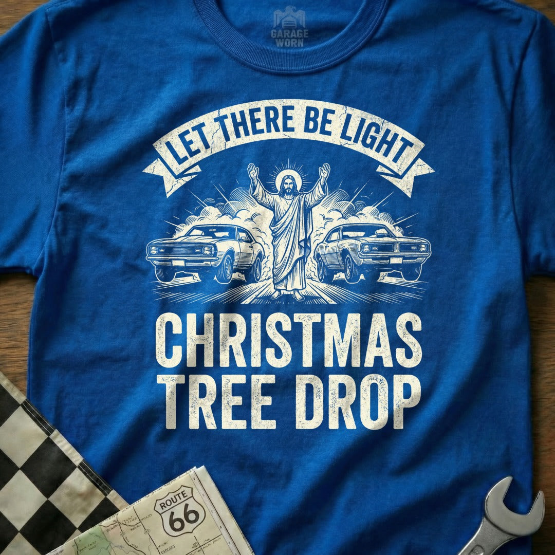 Jesus between two classic cars under "Let There Be Light Christmas Tree Drop" text.