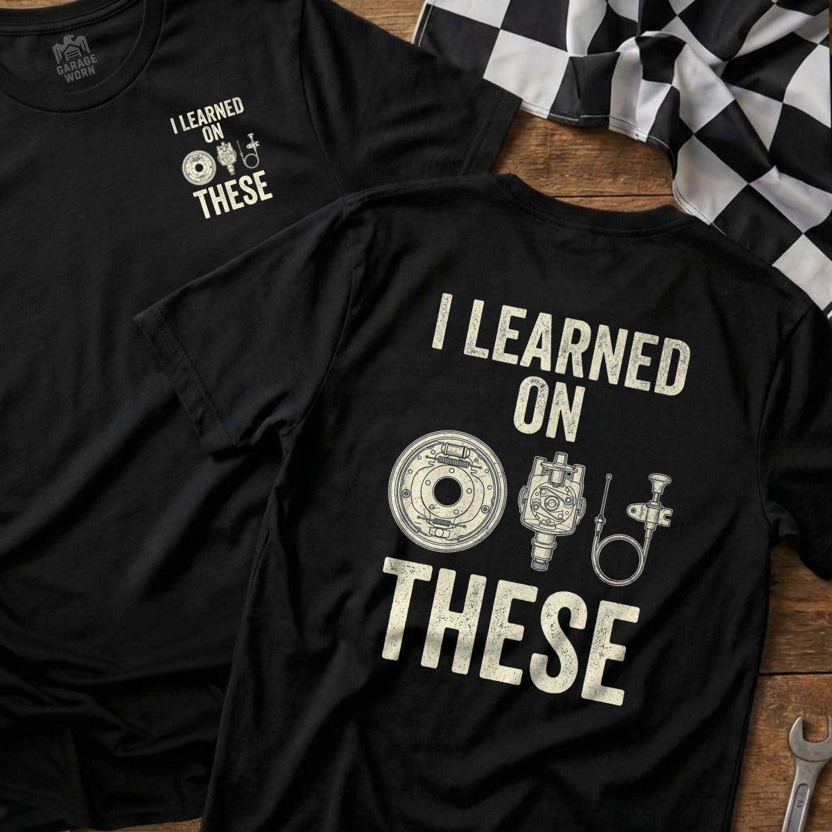 Black t-shirt with "I learned on these" and car parts graphic.