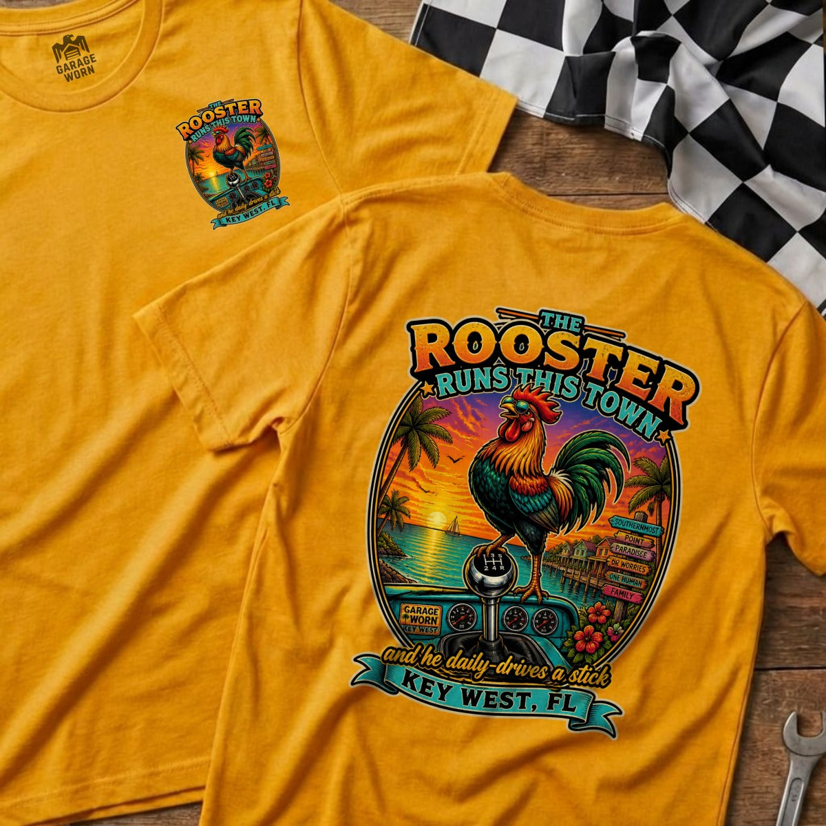 Yellow t-shirt with "The Rooster Runs This Town" graphic featuring a rooster, beach, and Key West text.