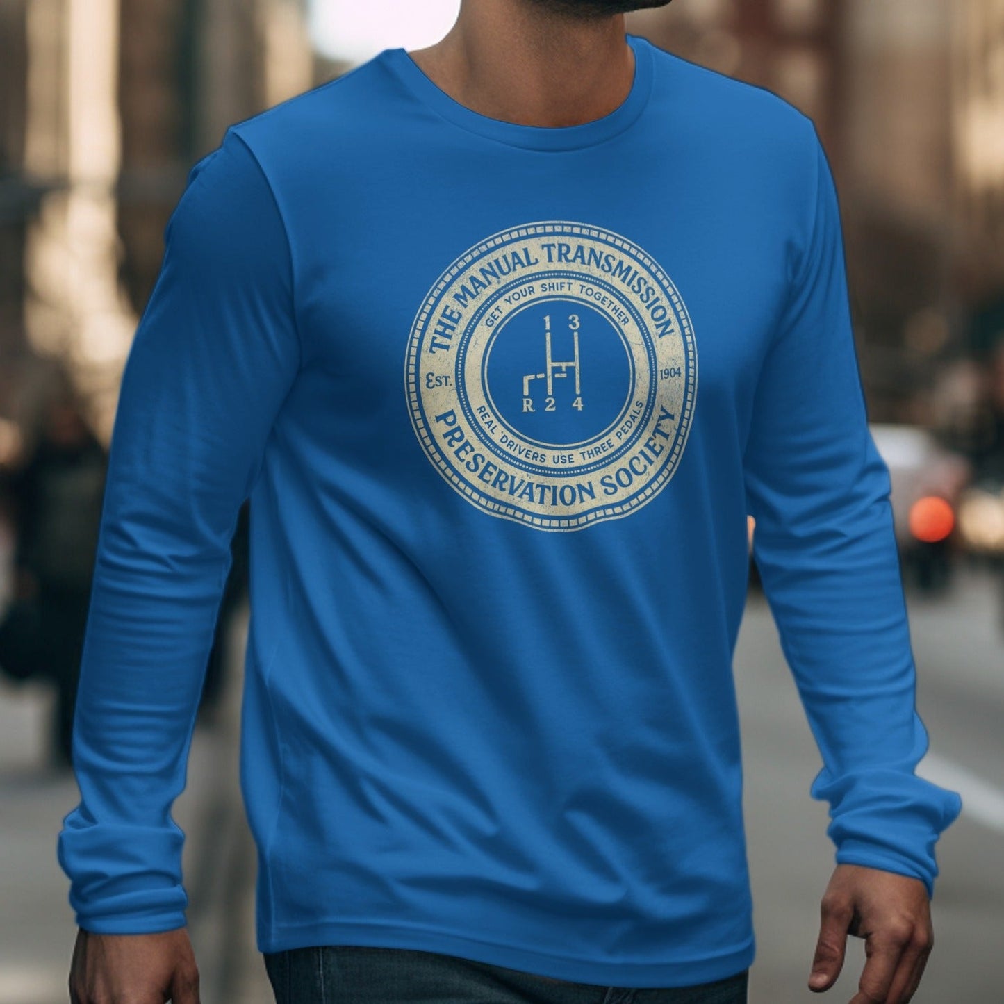 Blue long-sleeve shirt with "The Manual Transmission Preservation Society" circular logo.