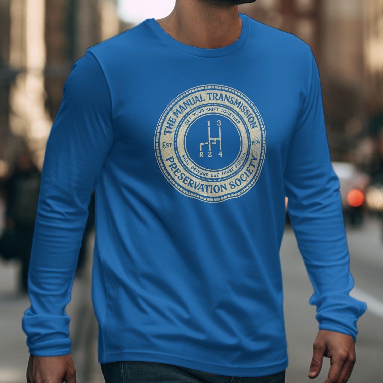 Blue long-sleeve shirt with "The Manual Transmission Preservation Society" circular logo.