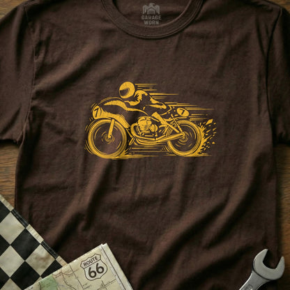 Brown t-shirt with yellow vintage motorcycle racing graphic and checkered flag accent.