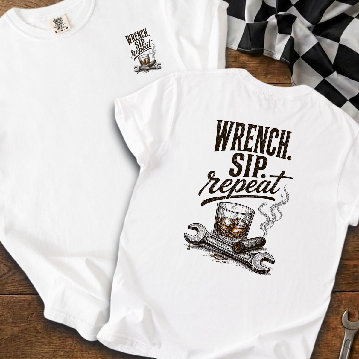 White t-shirt with "Wrench. Sip. Repeat." graphic and checkered flag.