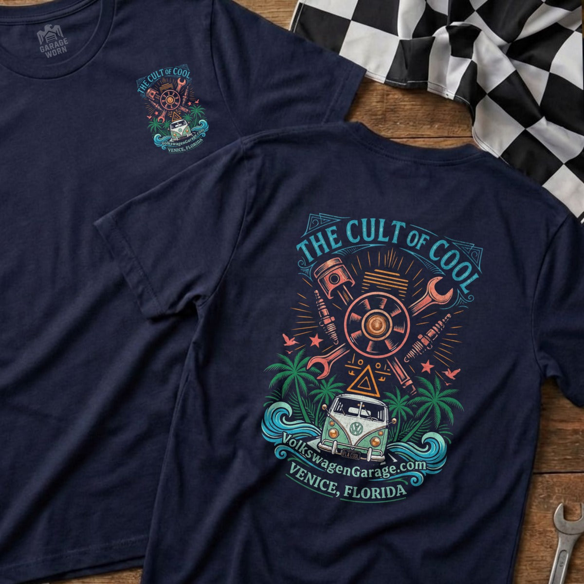Navy t-shirt with "The Cult of Cool" graphic featuring a VW van, palm trees, waves, and engine parts.