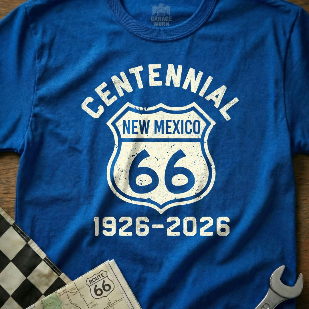 Blue t-shirt with "Centennial New Mexico 66 1926-2026" text in shield graphic.