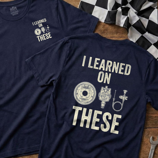 Dark navy t-shirt with "I learned on THESE" and brake parts illustration.