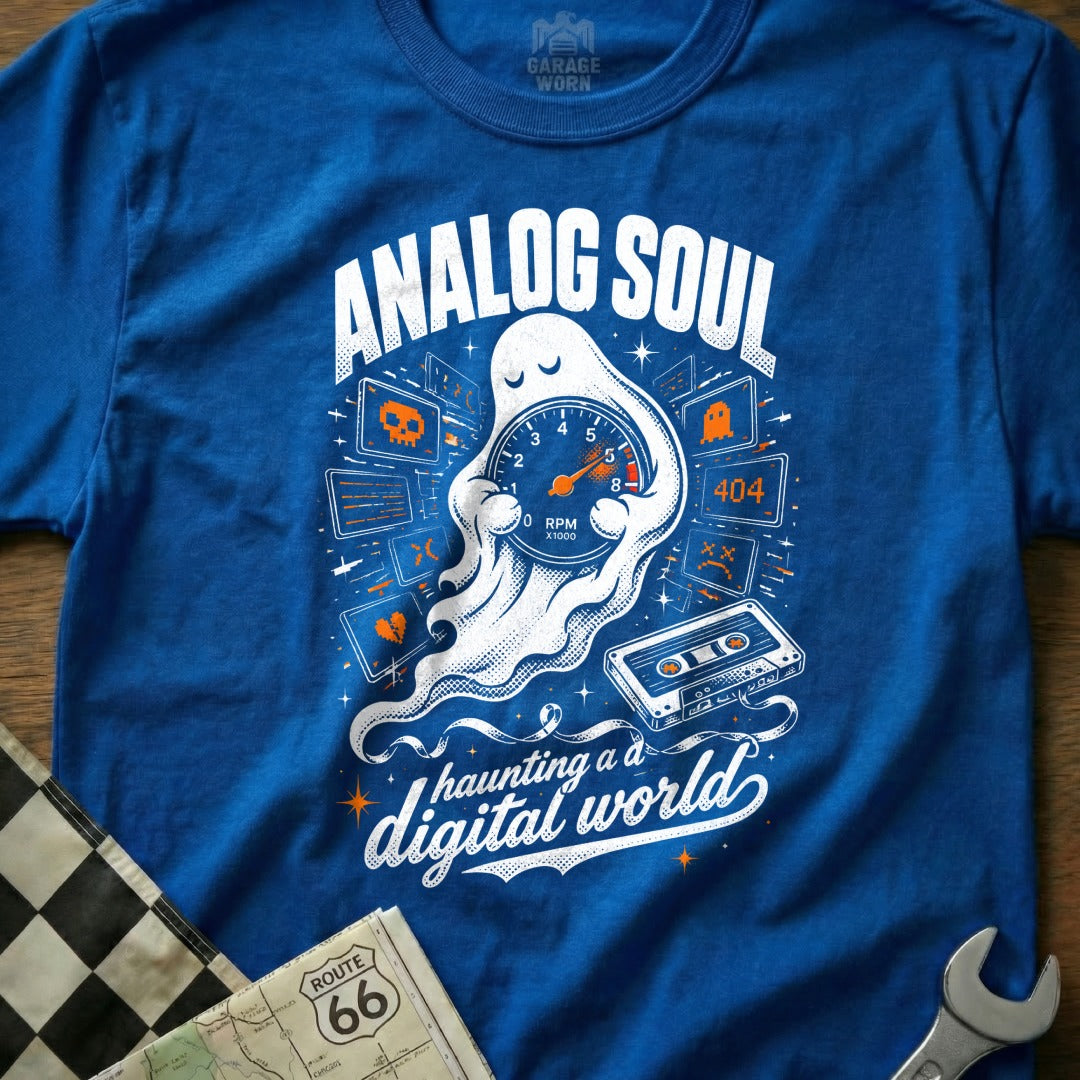 Blue t-shirt with "Analog Soul Haunting a Digital World" ghost graphic.