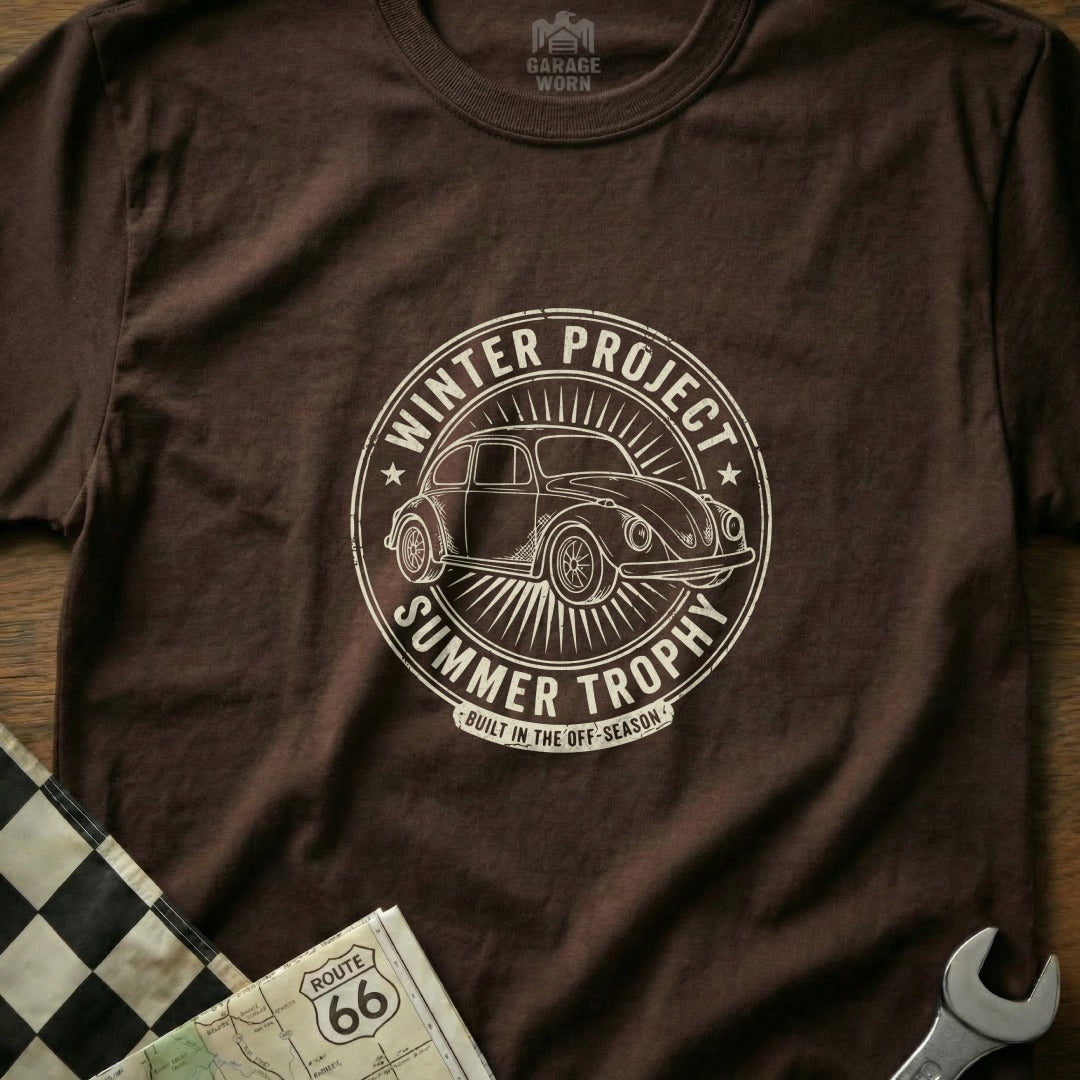 Brown t-shirt with circular graphic: "Winter Project Summer Trophy" and a vintage car.