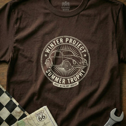 Brown t-shirt with circular graphic: "Winter Project Summer Trophy" and a vintage car.