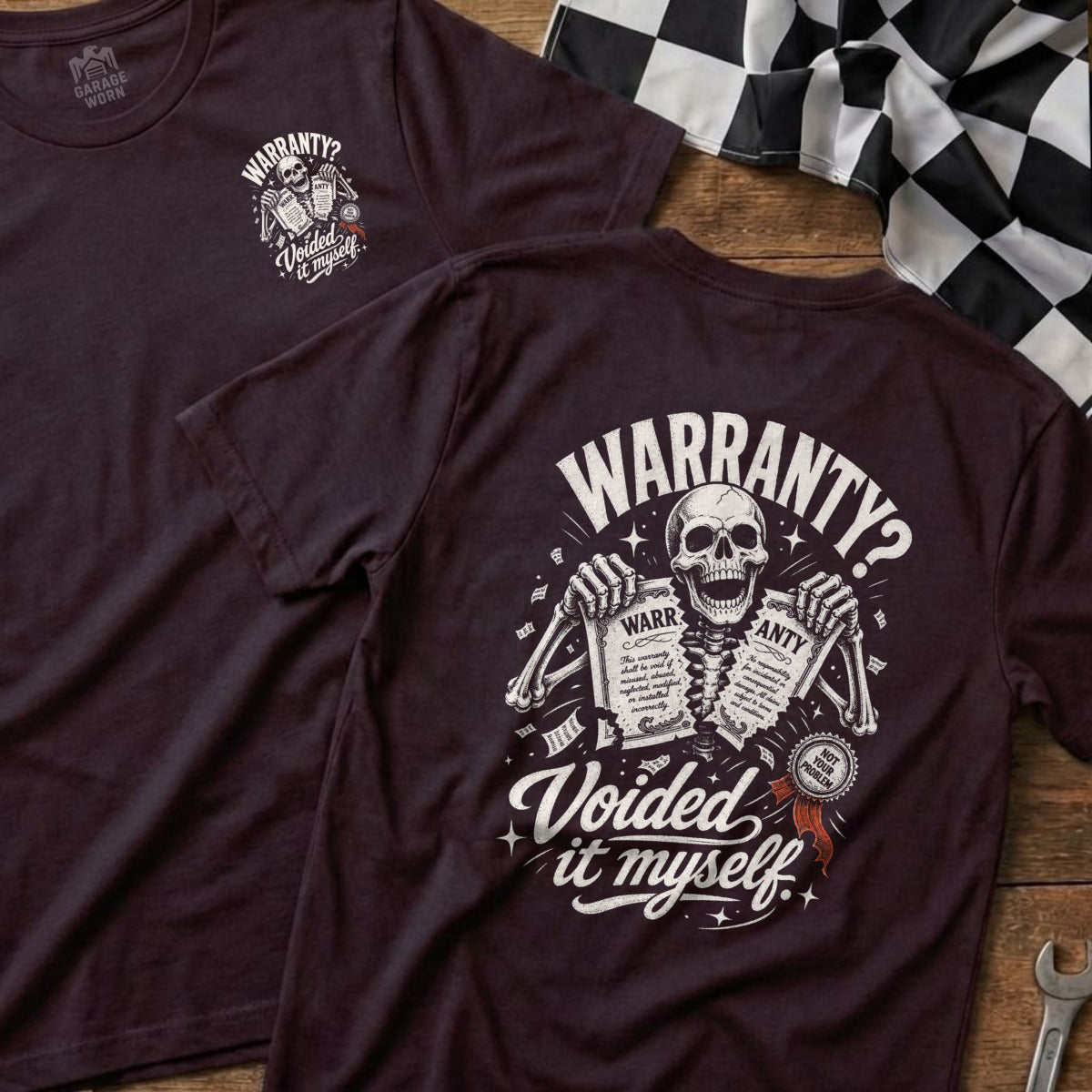 T-shirt with a skeleton graphic holding warranty papers titled "Voided it myself."
