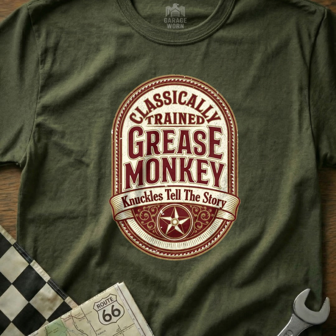 Olive green t-shirt with "Classically Trained Grease Monkey" text and star emblem.