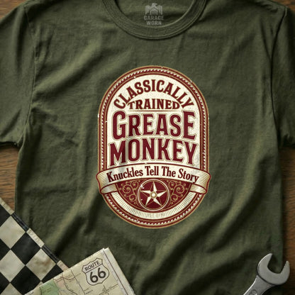 Olive green t-shirt with "Classically Trained Grease Monkey" text and star emblem.