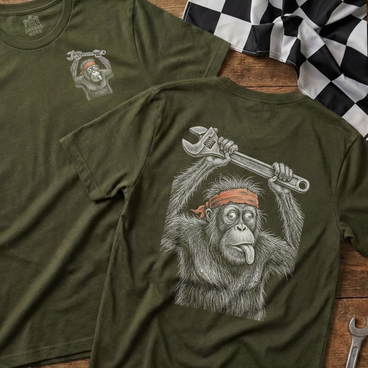 Orange t-shirt graphic of an orangutan holding a wrench, tongue out.
