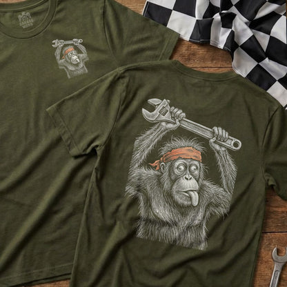 Orange t-shirt graphic of an orangutan holding a wrench, tongue out.