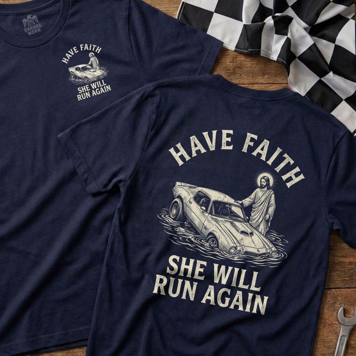 Navy t-shirt with "Have Faith She Will Run Again" and Jesus with a car.