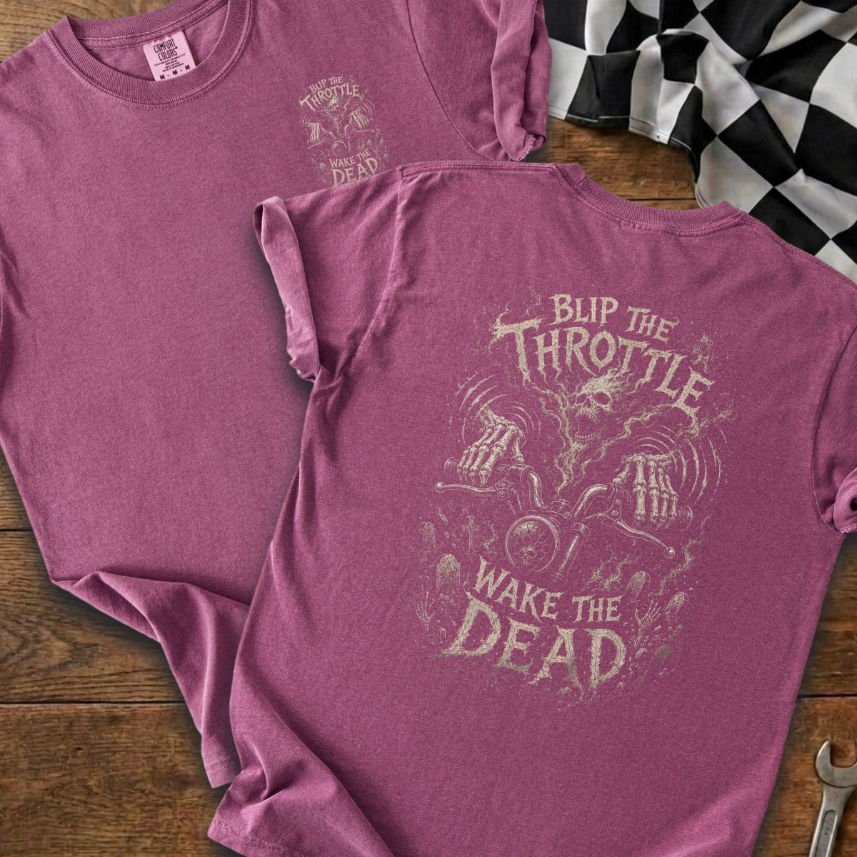 Pink t-shirt with "Blip the Throttle Wake the Dead" graphic featuring a skull and skeleton hands on a motorcycle.