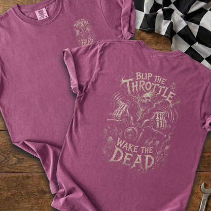 Pink t-shirt with "Blip the Throttle Wake the Dead" graphic featuring a skull and skeleton hands on a motorcycle.