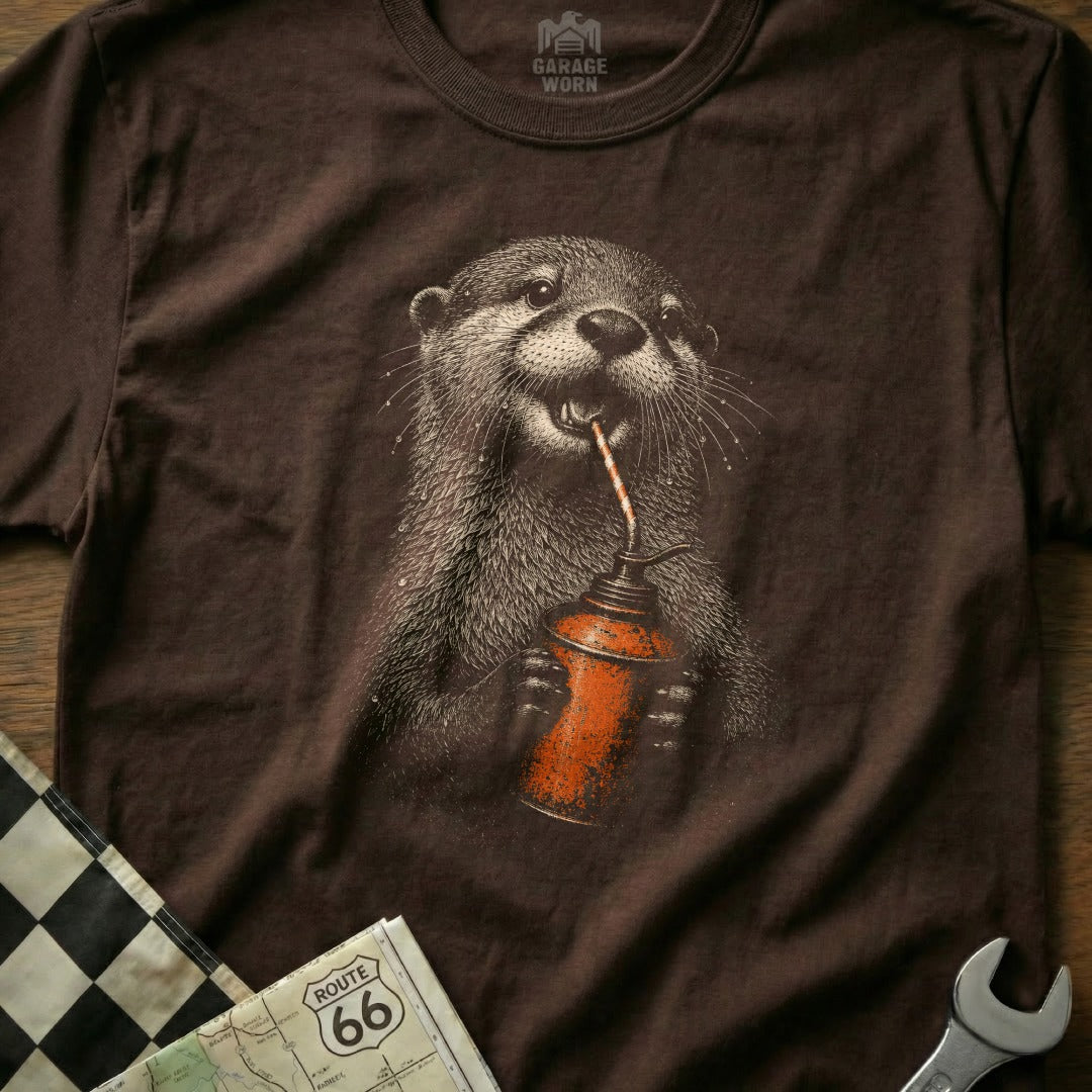 Brown t-shirt featuring an otter drinking from an oil can.