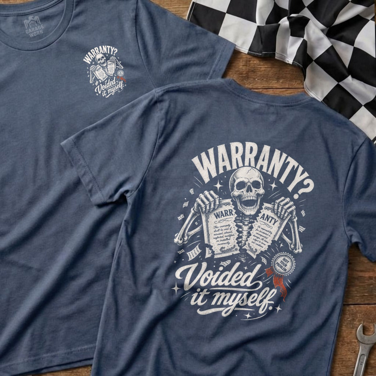 Blue t-shirt with skeleton graphic holding warranty papers; "Warranty? Voided it myself."