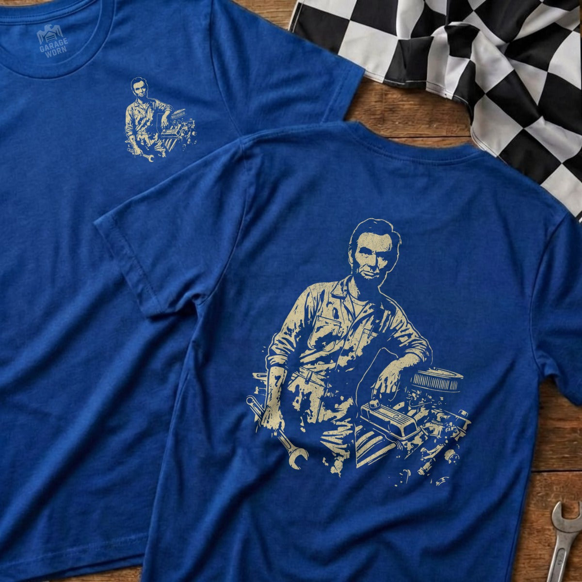Blue t-shirt with Abraham Lincoln leaning on an engine, Garage & Worn logo.