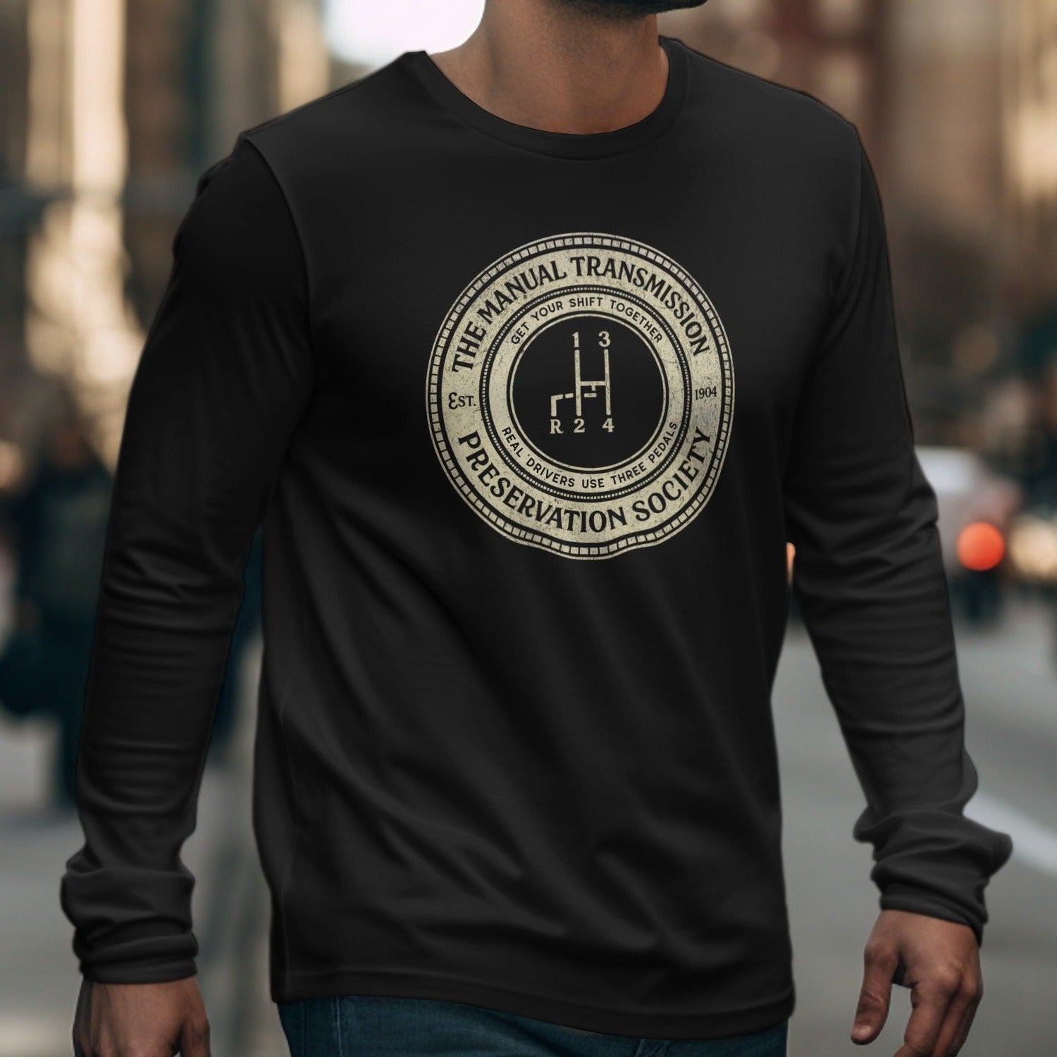 Black long-sleeve shirt with "Manual Transmission Preservation Society" circular graphic.