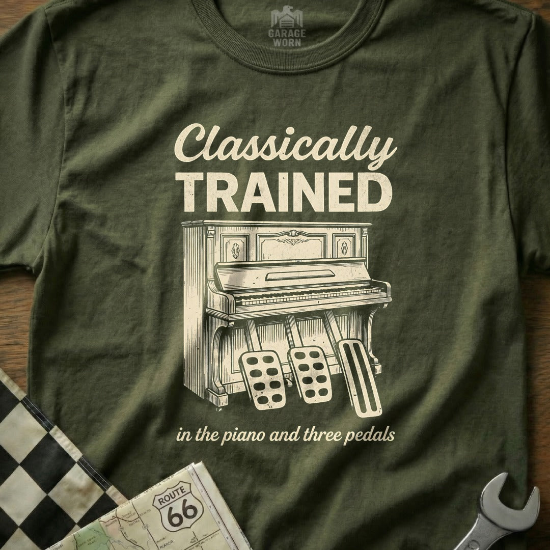 Olive green t-shirt with "Classically Trained" and an upright piano with three pedals.