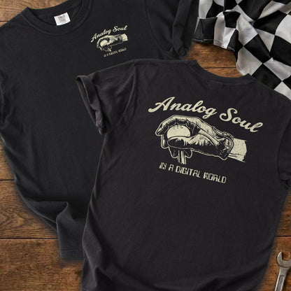 Black t-shirt with "Analog Soul in a Digital World" text and graphic.
