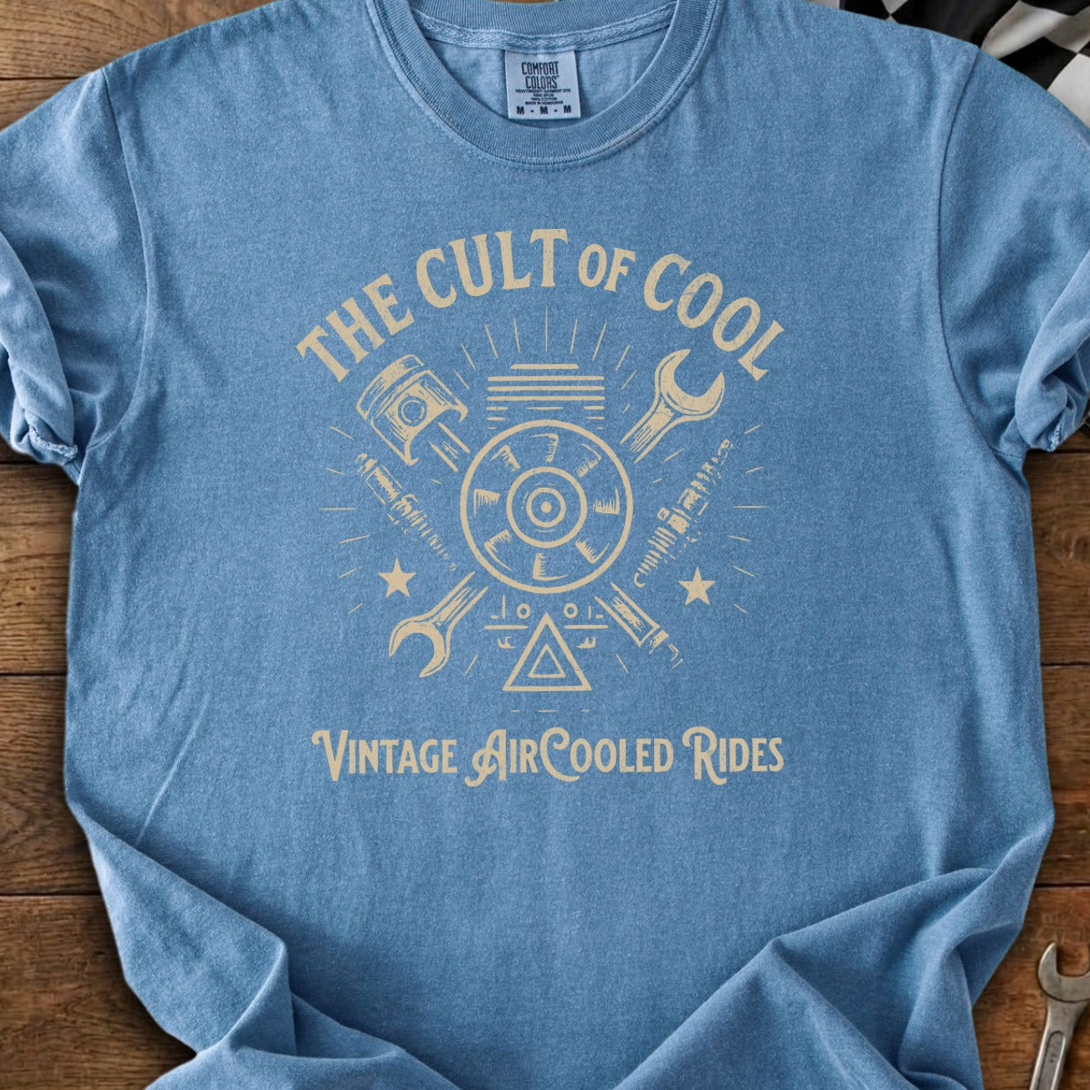 Blue t-shirt with "The Cult of Cool Vintage Air-Cooled Rides" graphic featuring engine parts.