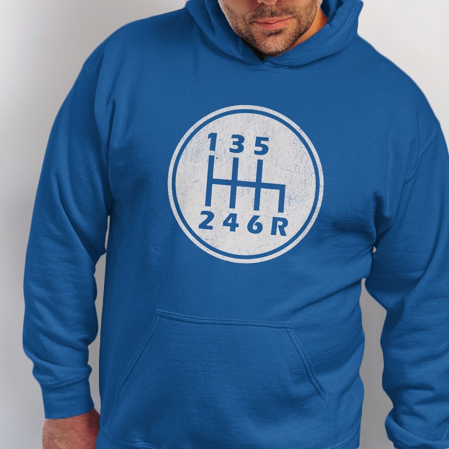 Blue hoodie with a circular graphic of a six-speed manual transmission shift pattern.