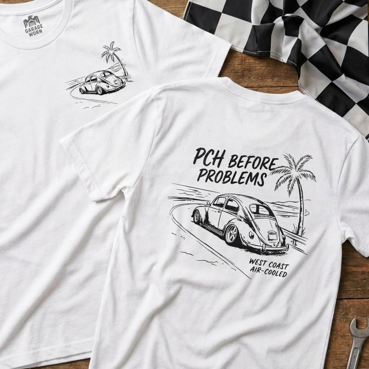 White t-shirt with a vintage car on a coastal road.