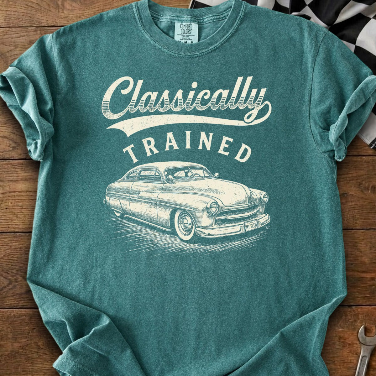 Teal t-shirt with "Classically Trained" text and vintage car graphic.