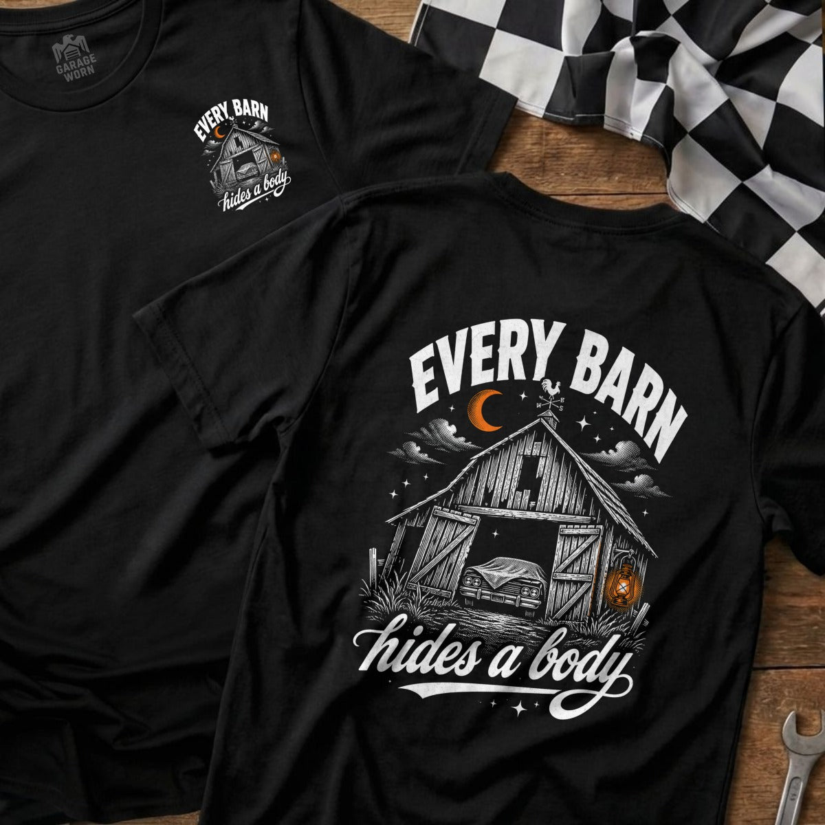 Black t-shirt graphic: barn with a car inside, moon, stars, and text.