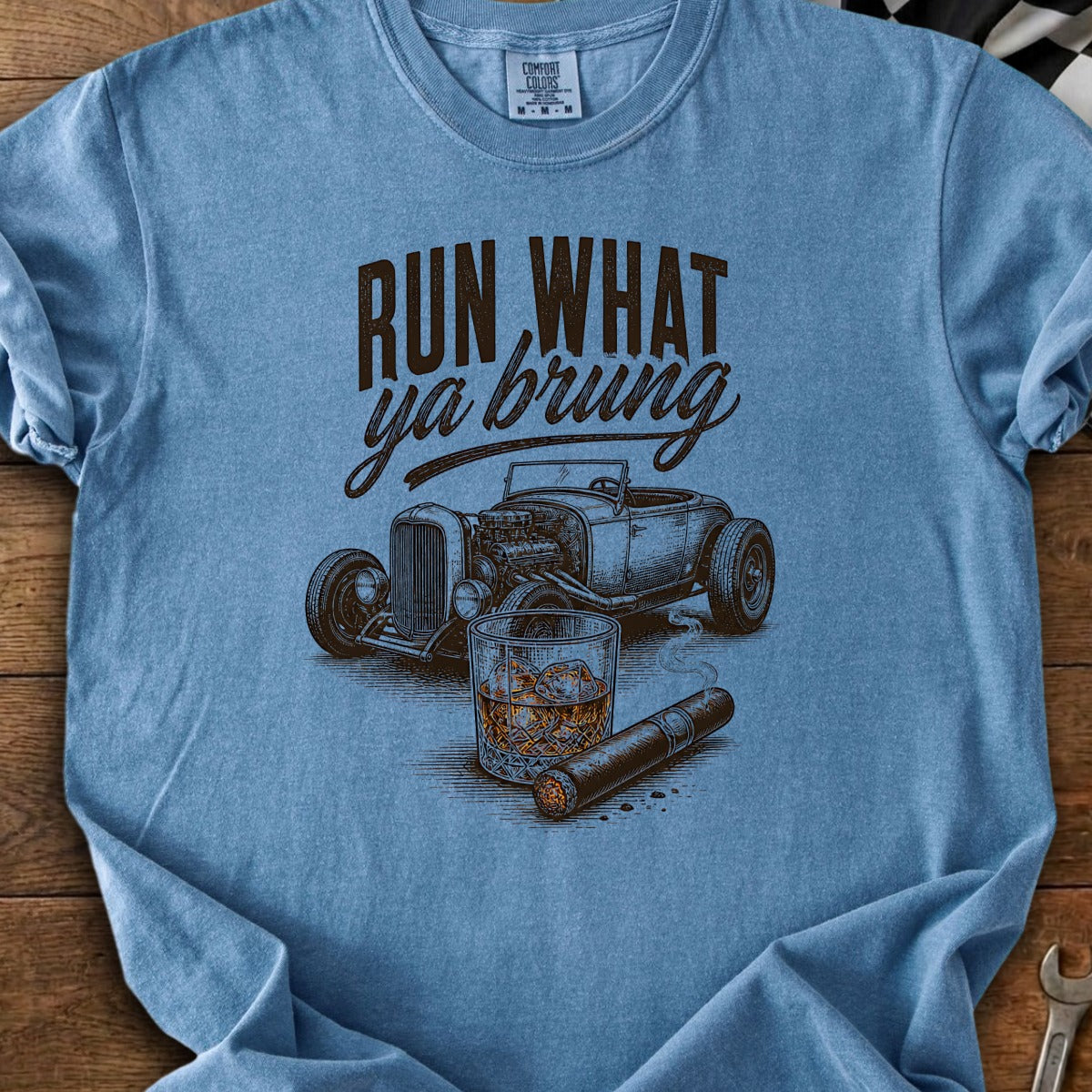Blue t-shirt with "RUN WHAT ya brung" text, hot rod, whiskey, and cigar graphic.