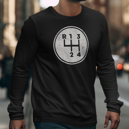 Black long-sleeve shirt featuring a circular graphic of a manual transmission gear shifter.